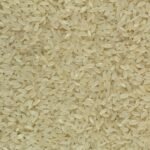 Detailed close-up of raw white rice grains, showing their texture and natural color.